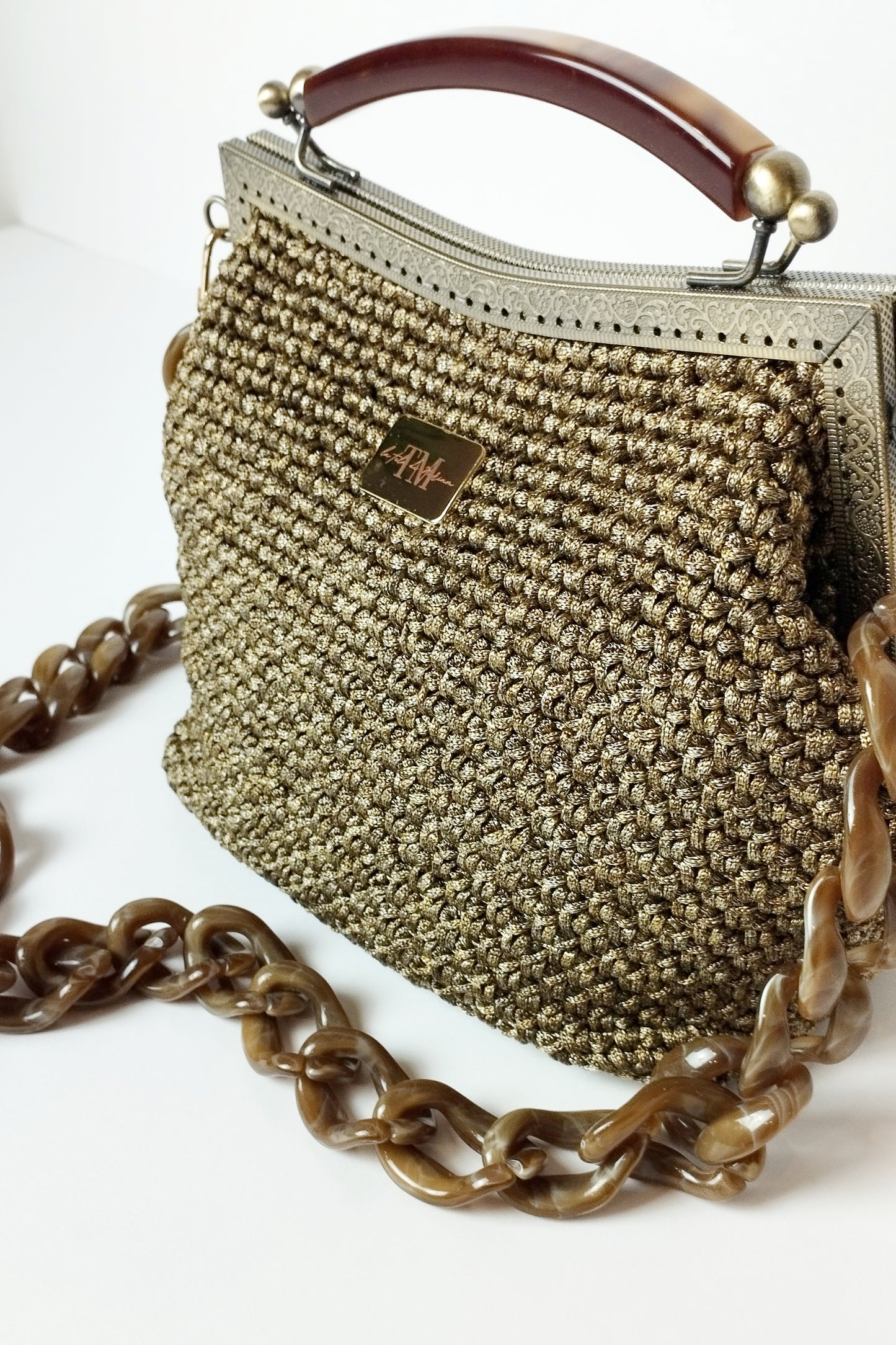 Borsa clutch uncinetto Susanna bronzo dettaglio manico